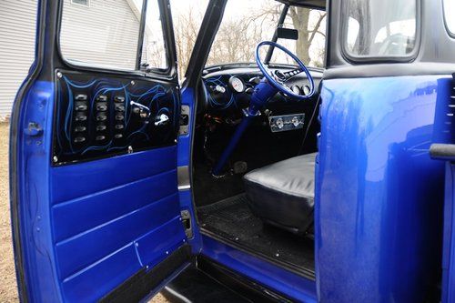1953 blue and black 5 window pickup truck