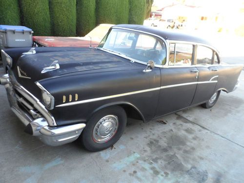 1957 chevy bel air 150 (1500) 4 door black sedan. solid project car