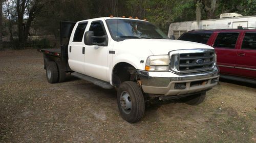 2001 f350 4 door crewcab  10 feet flat bed dually 4 wheel drive