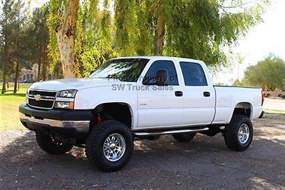 Lifted duramax diesel 4x4 new tires bedliner edge chip programmer custom stereo