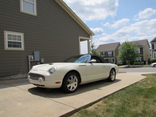 White exterior with white and black interior