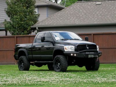 Quad cab short bed ( leather ) lifted! 5.9l cummins...like 2006. 1 tx owner 38k