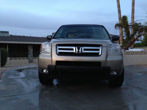 2007 honda pilot lx,4x4,3rd row,automatic,rear ac,custom wheels,new suspension