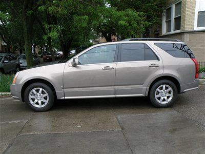 2007 cadallic srx all wheel drive! dual roofs,rear ac,3 row seats! low reserve!!