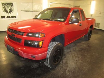 Red hot 2005 chevrolet colorado with all black wheels