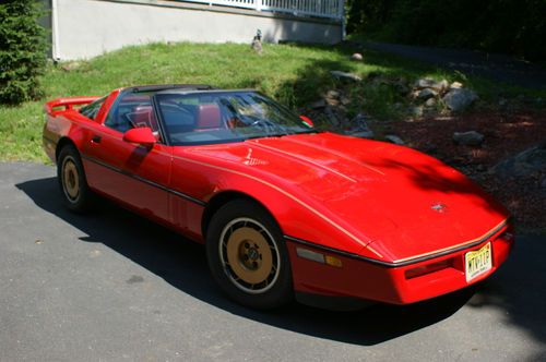 Classic vintage 1985 red chevy corvette car targa top sport roof 2 door coupe