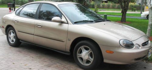 1999 ford taurus gold 4d 6cyl sel sun roof am/fm/cd/cassette 1 owner 88k miles