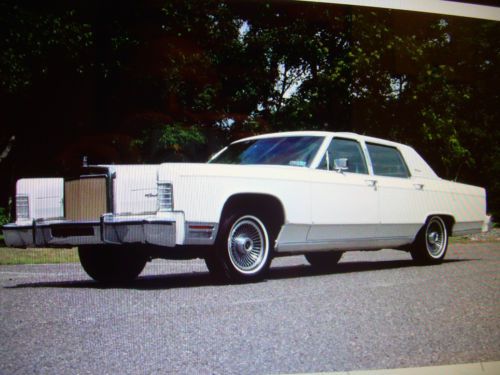 1979 lincoln towncar white exterior with navy blue leather interior.