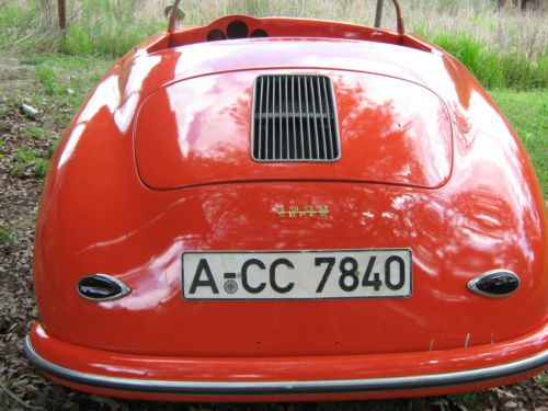 1956 porsche 356 speedster in tangerine orange. some porsche 2.7 engine parts