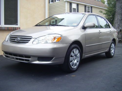 2003 corolla automatic tan gas saver pre-owned excellent condition must sell