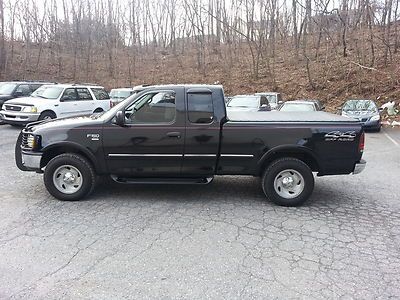 No reserve_extended cab_alloys_tonneau cover_grill guard_good tires_clean_4x4___