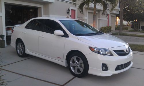 White 2012 toyota corolla s, 8,000 miles, showroom condition, fl car, new