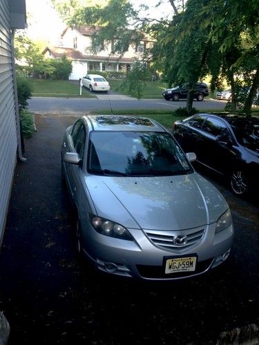 2005 silver mazda 3-4 door sedan in good condition. 2.3l engine, automatic