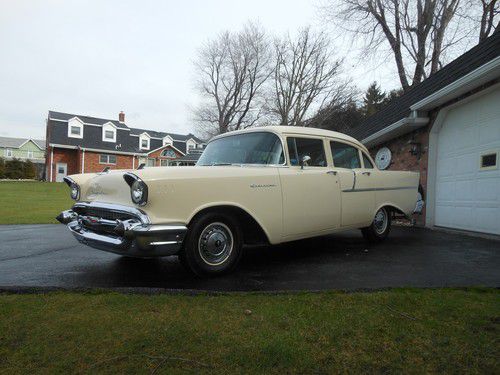 1957 chevrolet 150.  four door sedan.  factory a/c.  only 12,500 miles!