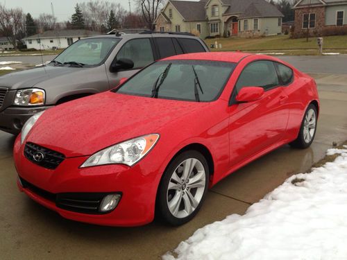 8,500 miles!! red 3.8 liter v6 2 door genesis coupe.