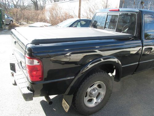 Black 2002 ford ranger v-6 4-door with manual transmission &amp; cover