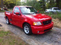 Svt ford f150 lightning  supercharged! red. a true virgin!