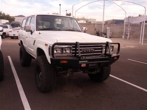 1989 toyota land cruiser fj62 4 door 4x4 lifted with 35" tires and winch bumper