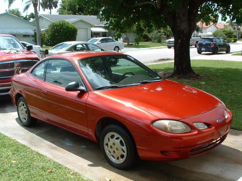 Red - 2 door coupe / 4 cyl - 5 speed manual trans. in great cond. 30 mpg