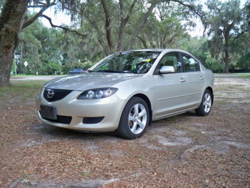 2004 mazda 3,automatic,cold a/c,am/fm c/d,runs drives,sharp,great,last bid wins