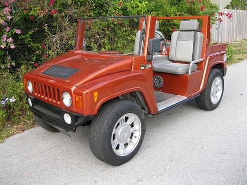 Hummer h3 electric golf cart by american custom golf cars