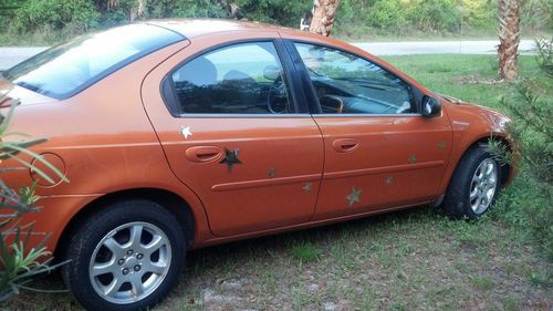 2005 dodge neon sxt sedan 4-door 2.0l  customized with stars on it