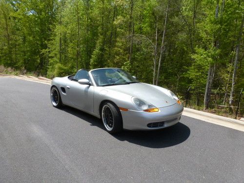 Good condition silver + fast porsche boxster s replica convertible on 19" tires.