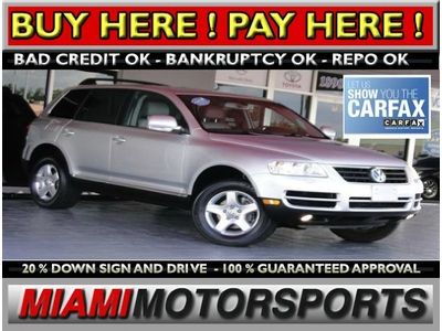 We finance '05 volkswagen v6 awd suv leather sunroof parking sensors alloywheels