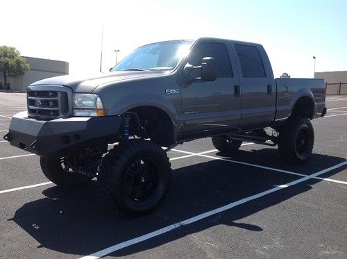 2002 ford f-250 super duty lariat crew cab 4-door 7.3l diesel lifted beast!!!