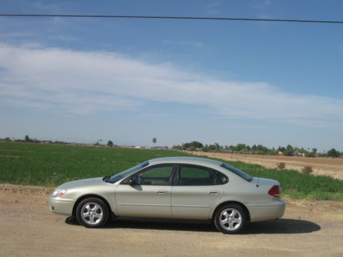 2005 ford taurus se sedan, 119k mi., v-6, a/c!  full pwr. auto-check rept. incl.