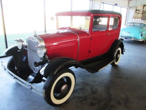 Red and black ford model a 1930 with immaculate tan interior