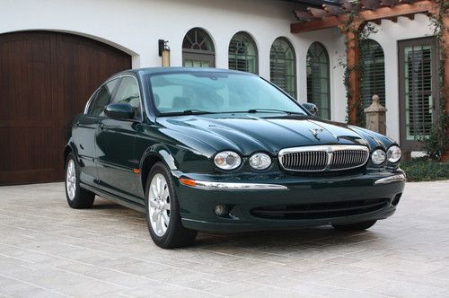 Awd 2.5, dark green with ivory leather interior, excellent condition, 78k miles