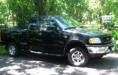 1998 ford black f-150 xlt extended cab short bed step side 4x4 pickup truck