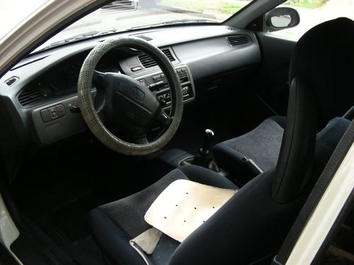 white, hatchback, 175k miles, good mpg, a/c, radio, tape deck, new tires,1992, image 3