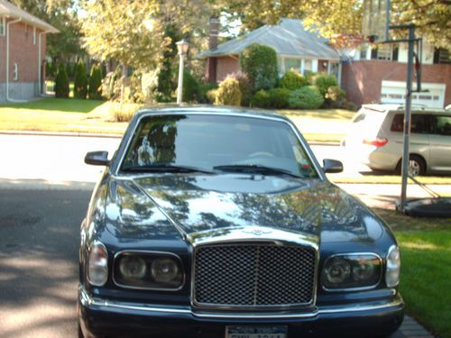 Gray, red label, headrest t.v's, garage kept, weekend car