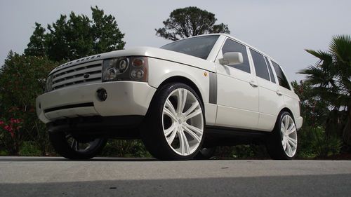 2oo4 range rover hse, oh my lord...custom white exterior with a set of 26" rims!