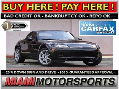 We finance '06 mazda manual convertible abs am/fm/cd a/c alloy wheels fog lights