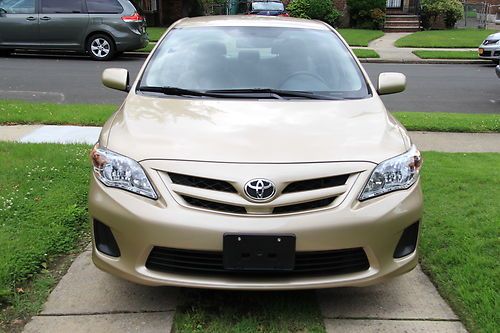 2011 toyota corolla le-warranty, one owner, gold color 4 door sedan