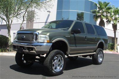 Take a look at this 8in lifted bad boy 4x4 2002 ford excursion limited