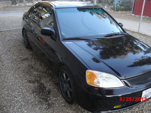 Black honda civic lx runs excellent, vtec, new tires on m&amp;b racing rims, 4 door.