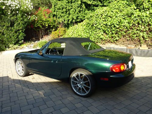 1999 mx-5 miata, enkei wheels, roll bar, new top, polk audio, kicker, great cond