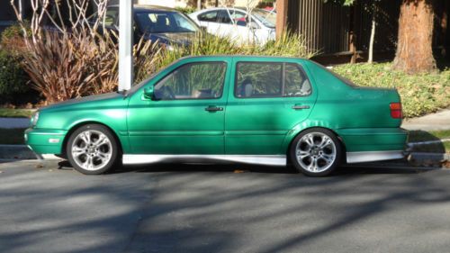 1996 vw jetta with custom paint, body kit, rims and modified parts.