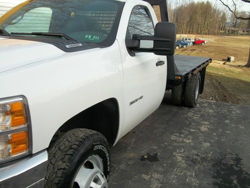 2011 3500  12' flat bed 1 ton dually; single cab 4wd