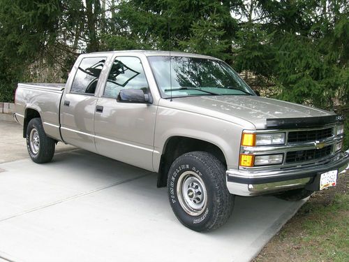 Beige crew cab, leather interior, all power, towing package, only 81,423 miles!!