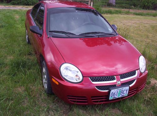 2004 dodge neon sxt, red with dark tinted windows, 5 speed, only 67k miles!!!