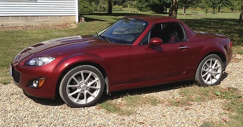 Low mileage 2010 grand touring hard top convertible