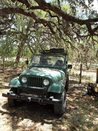 Hunting vehicle including chairs for front and top, 150 lb feeder for back