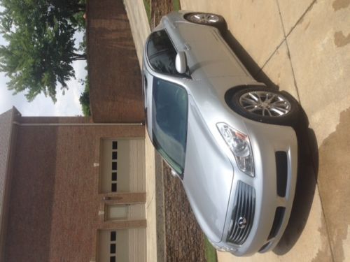 Silver exterior with stone interior trim.  g35 excellent condition