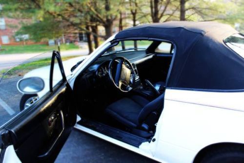 Convertable white w/black top, black interior, 5 speed manual; sirius radio