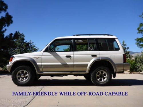 4-door 7-passenger off-road ready. 131,006 miles. white, leather interior,